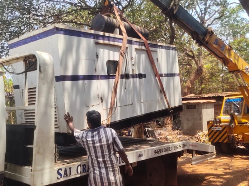Heavy diesel generator being lifted for delivery in Goa